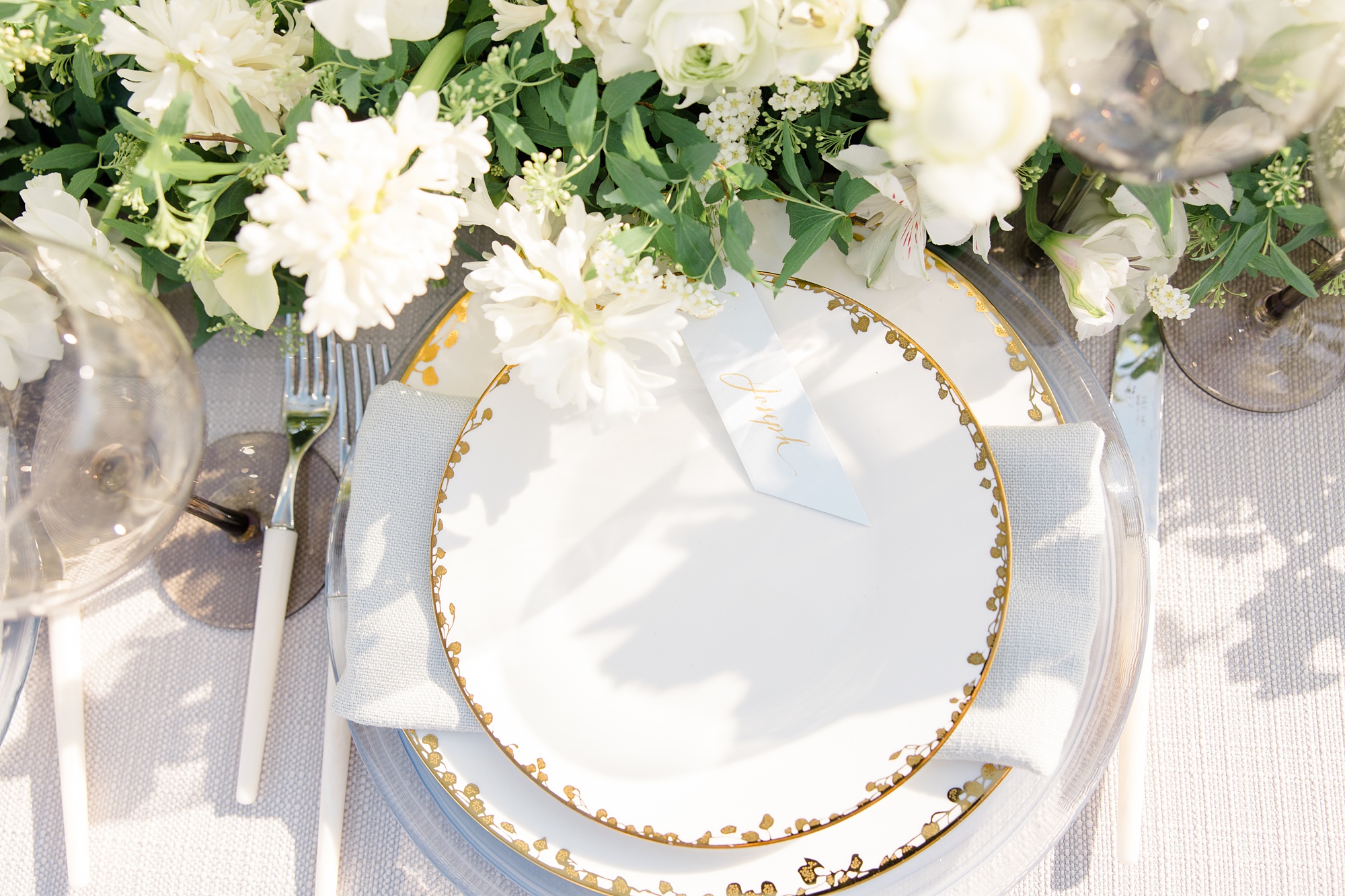 white plates with gold rim for wedding reception on Folly Beach