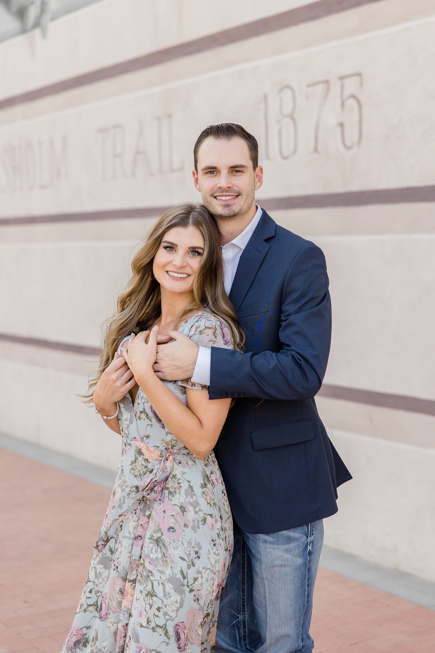 man hugs fiancee during Fort Worth engagement session