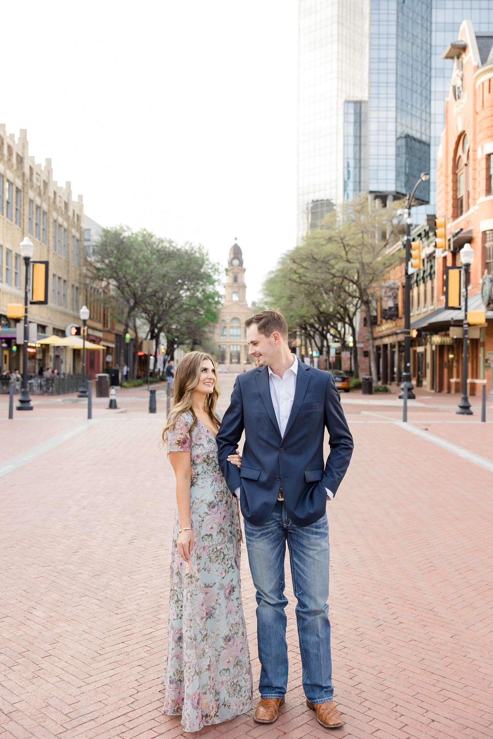 engaged Texas couple poses in downtown Fort Worth 