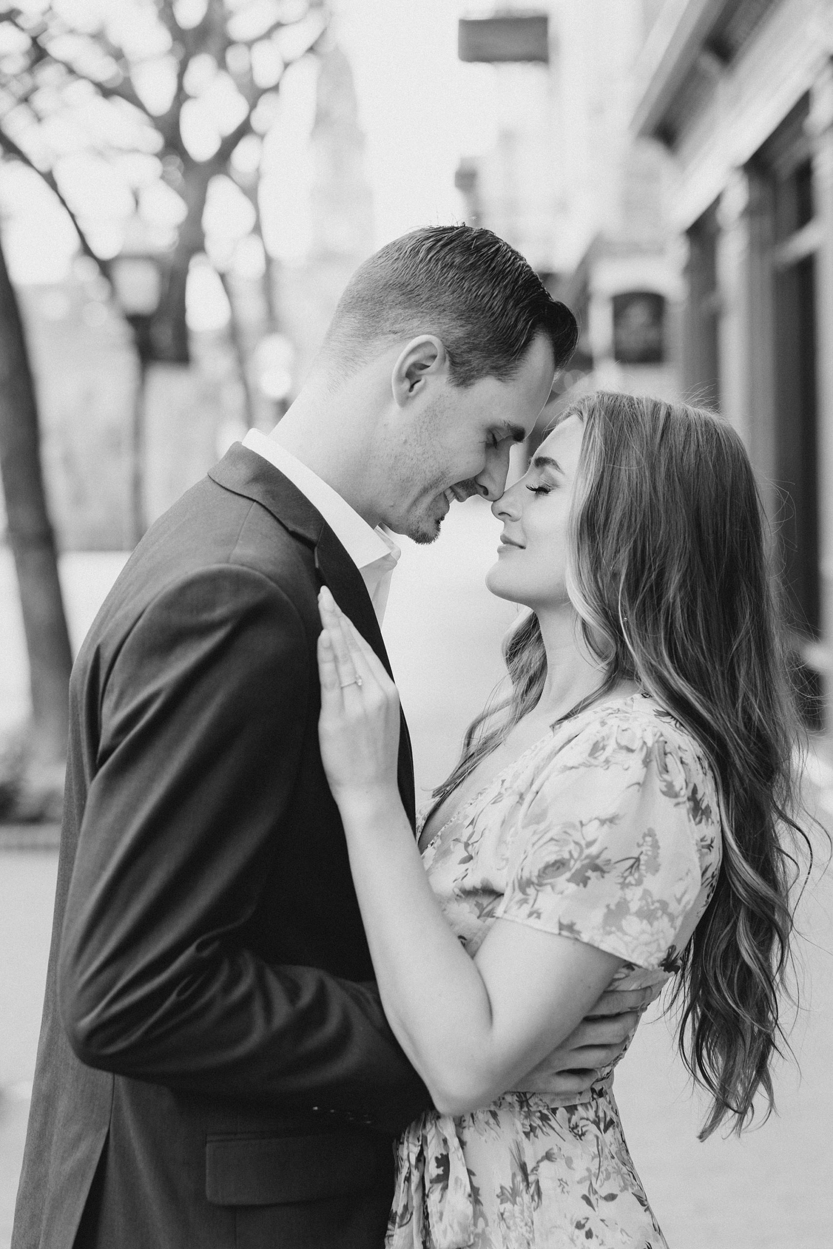 engaged couple leans noses together during TX engagement photos