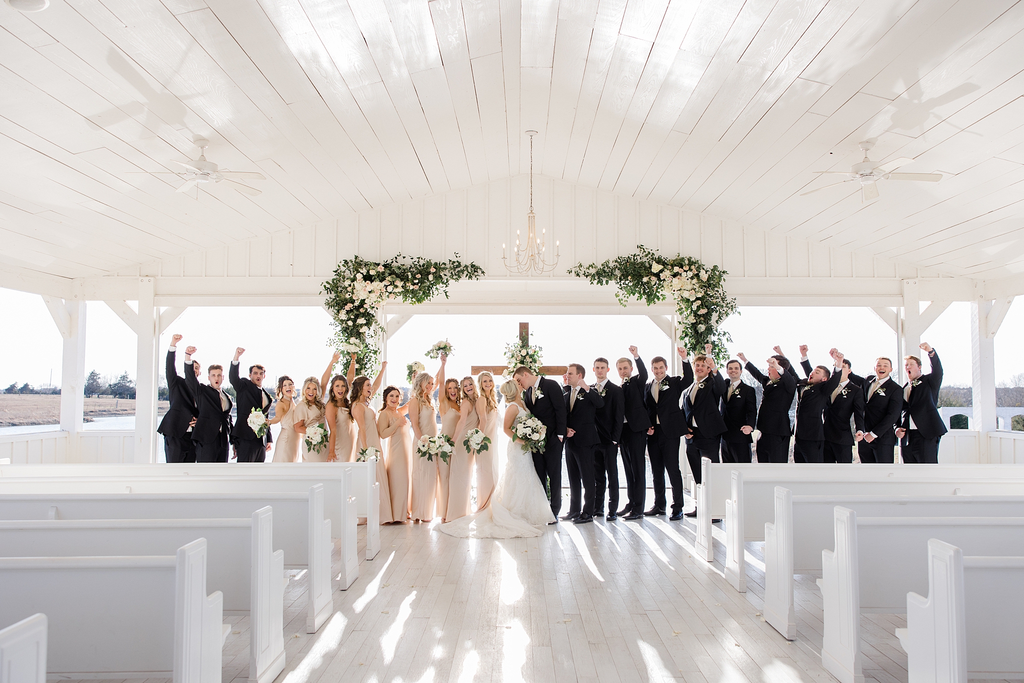 bridal party stands by ceremony site at The Grand Ivory