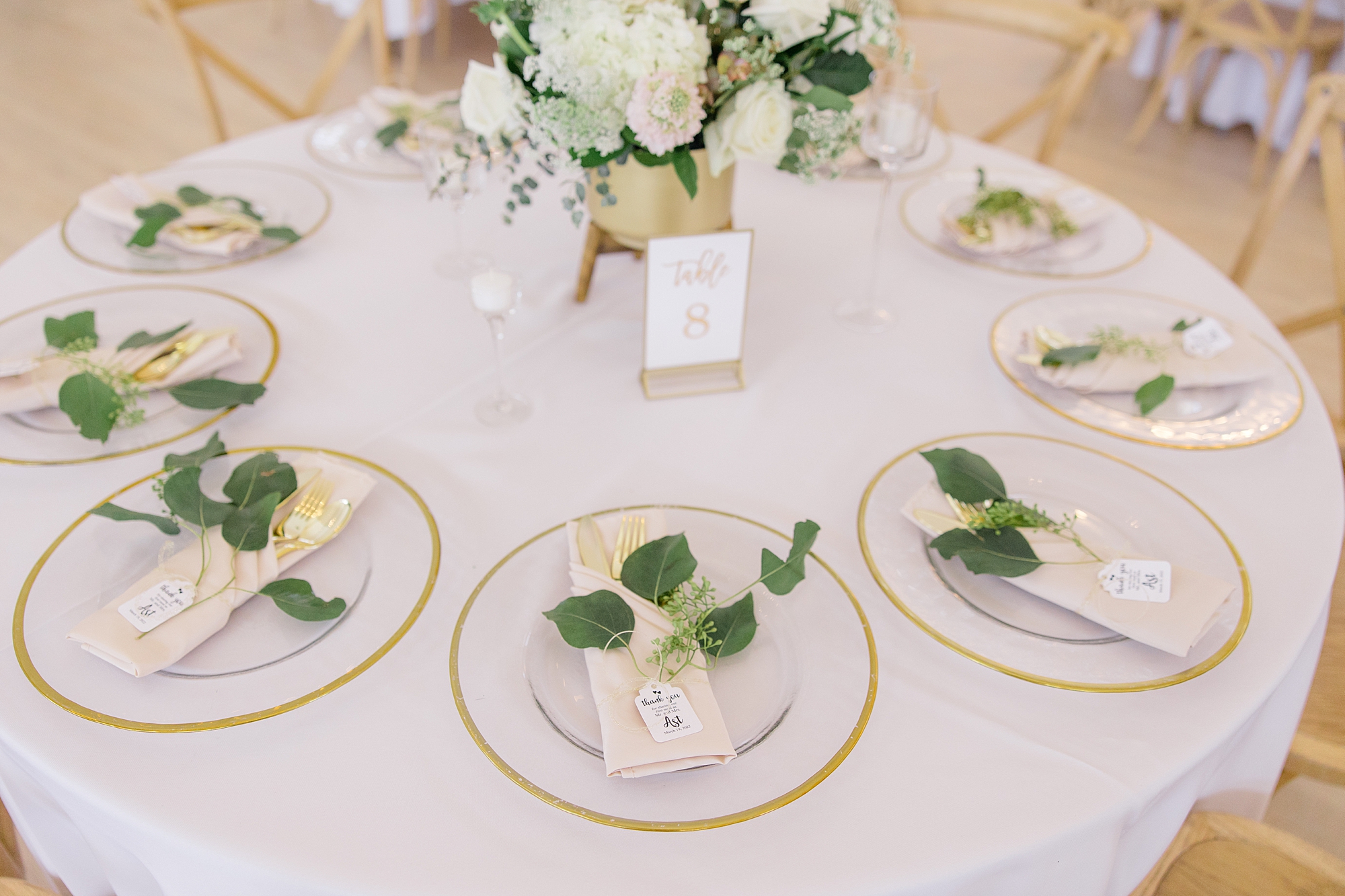 place settings with gold rimmed plates at the Grand Ivory