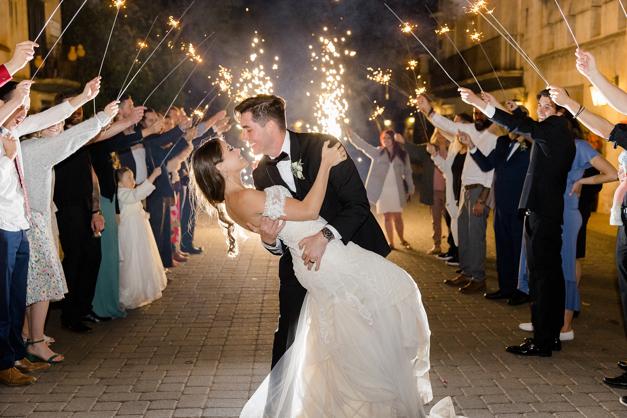 bride and groom kiss during sparkler exit at Tlaquepaque