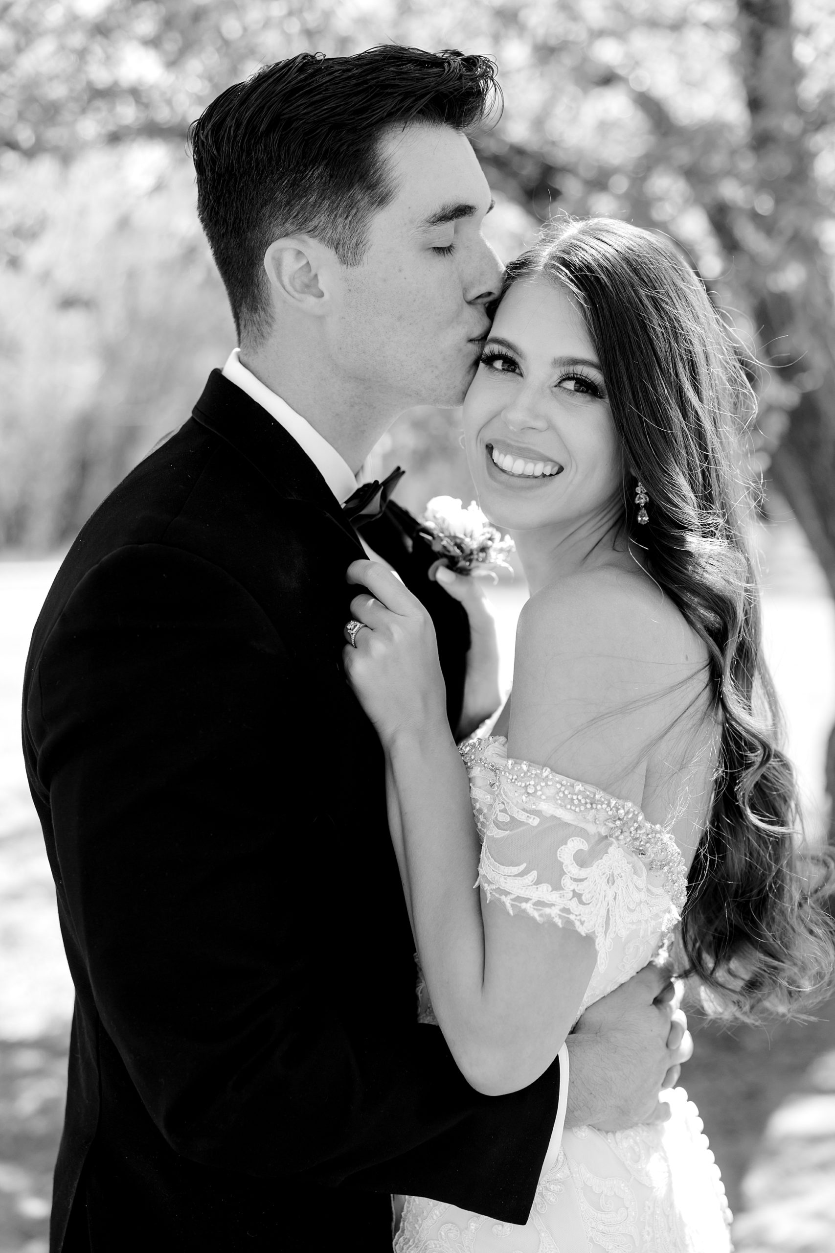 groom kisses bride's forehead during AZ wedding photos