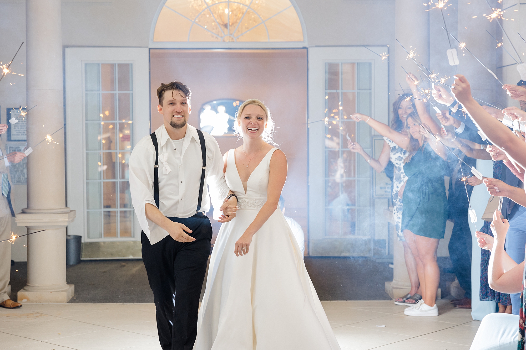 newlyweds leave wedding reception in sparkler exit 