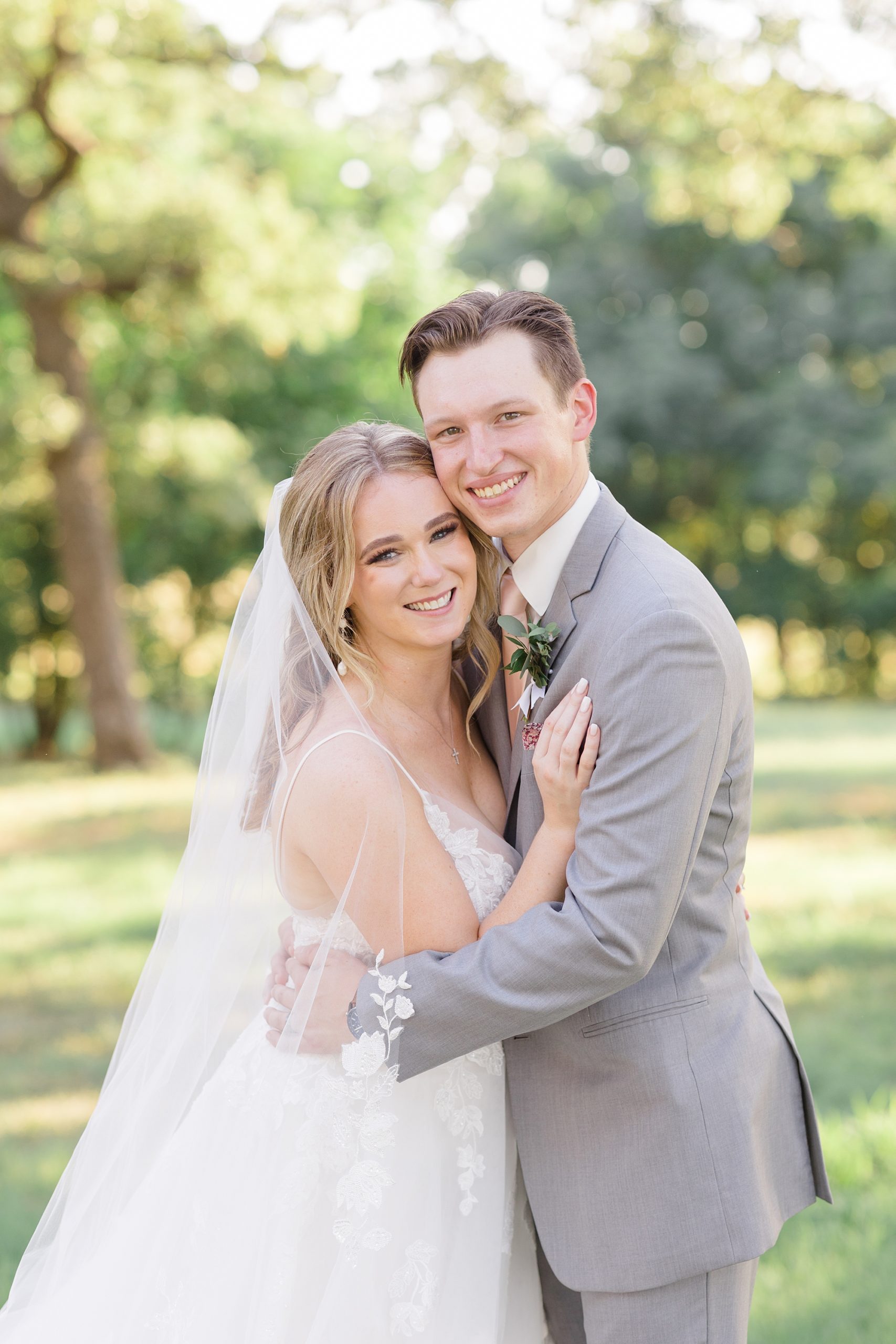 couple hugs during wedding portraits in Dallas TX