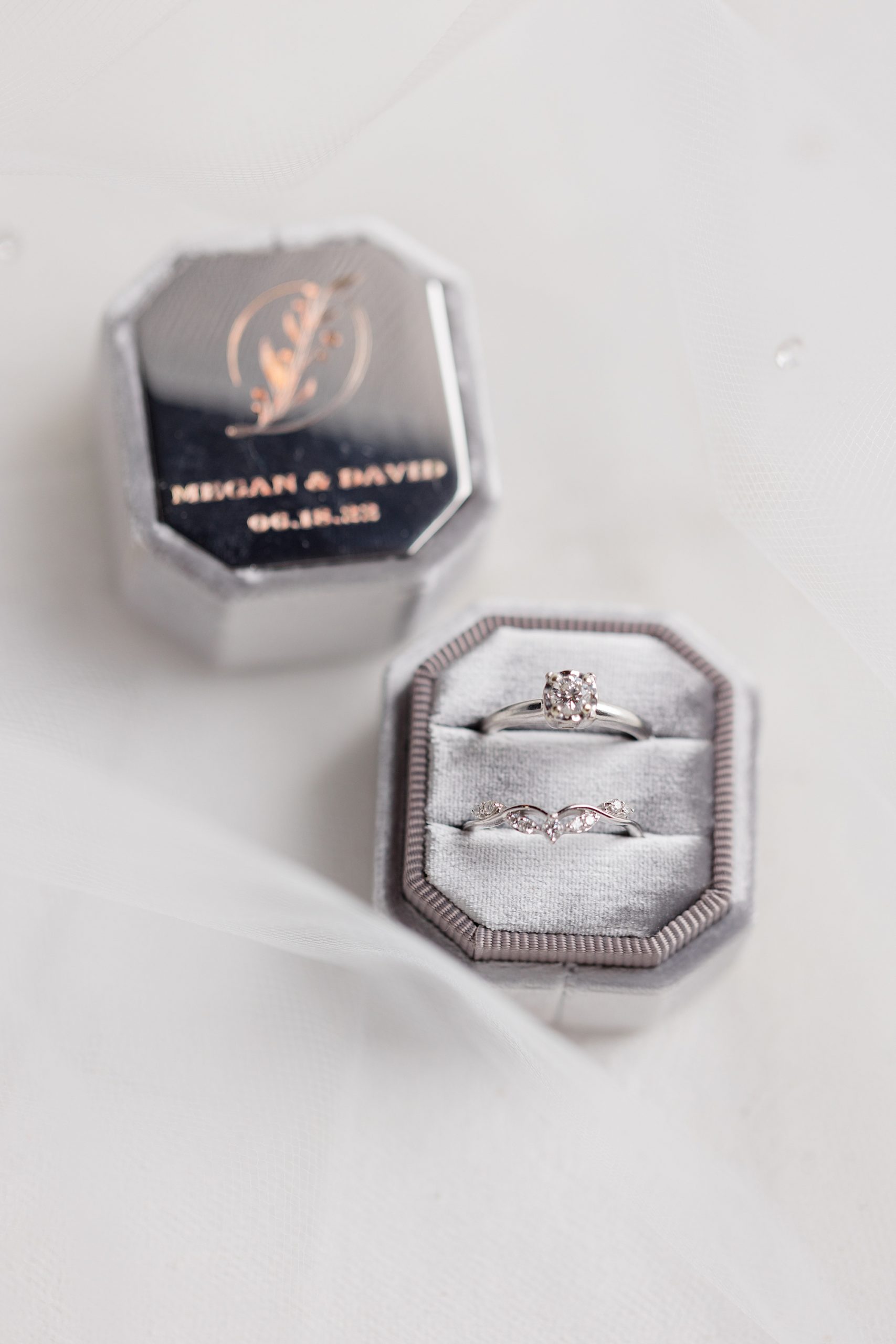 wedding bands rest in silver ring box