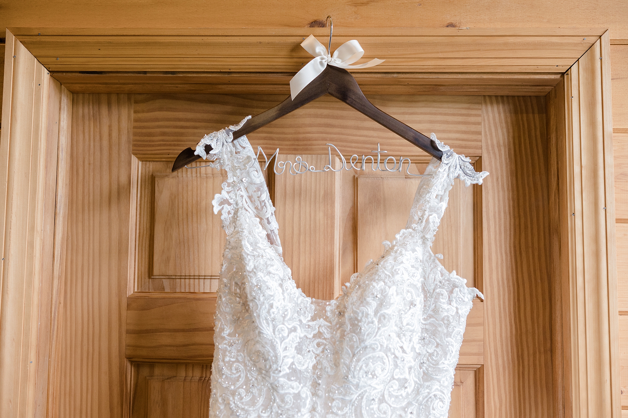 wedding dress hangs on custom hanger