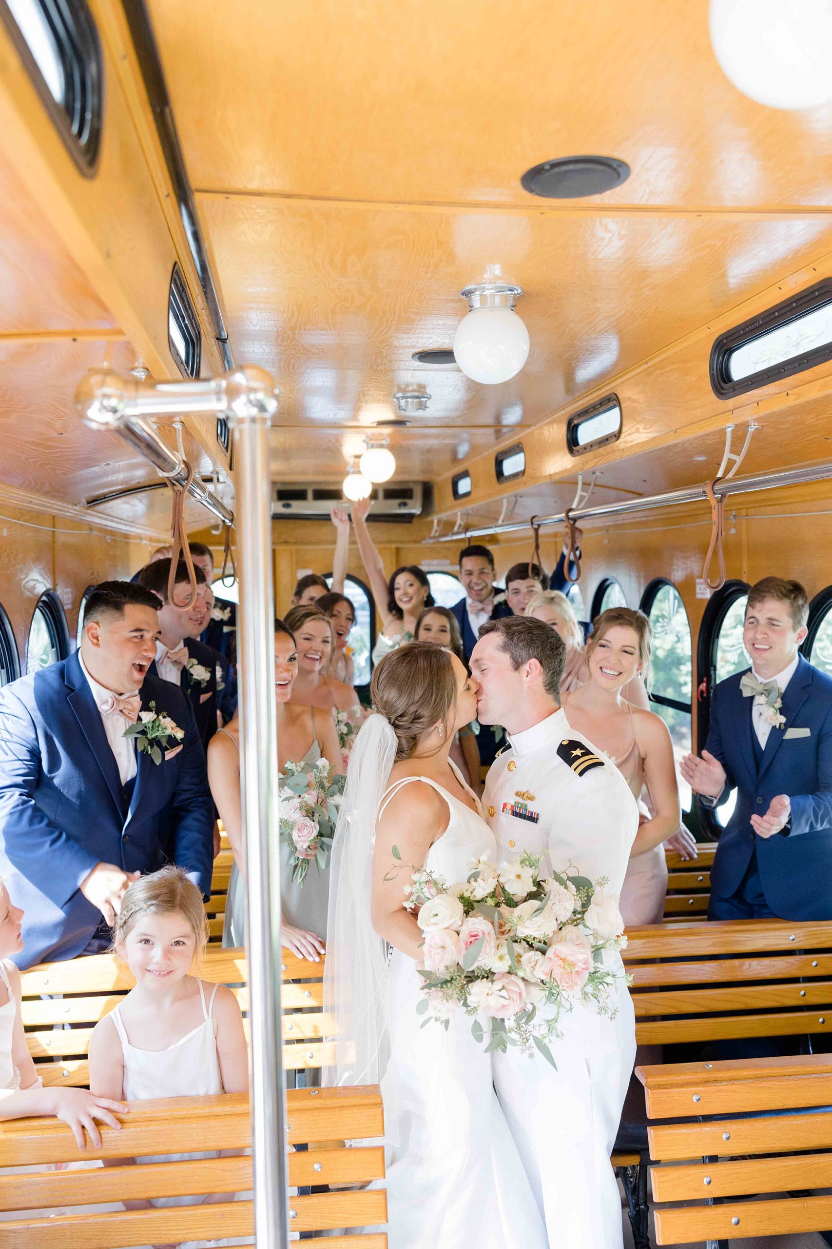 bride and groom kiss on trolley in Charleston SC