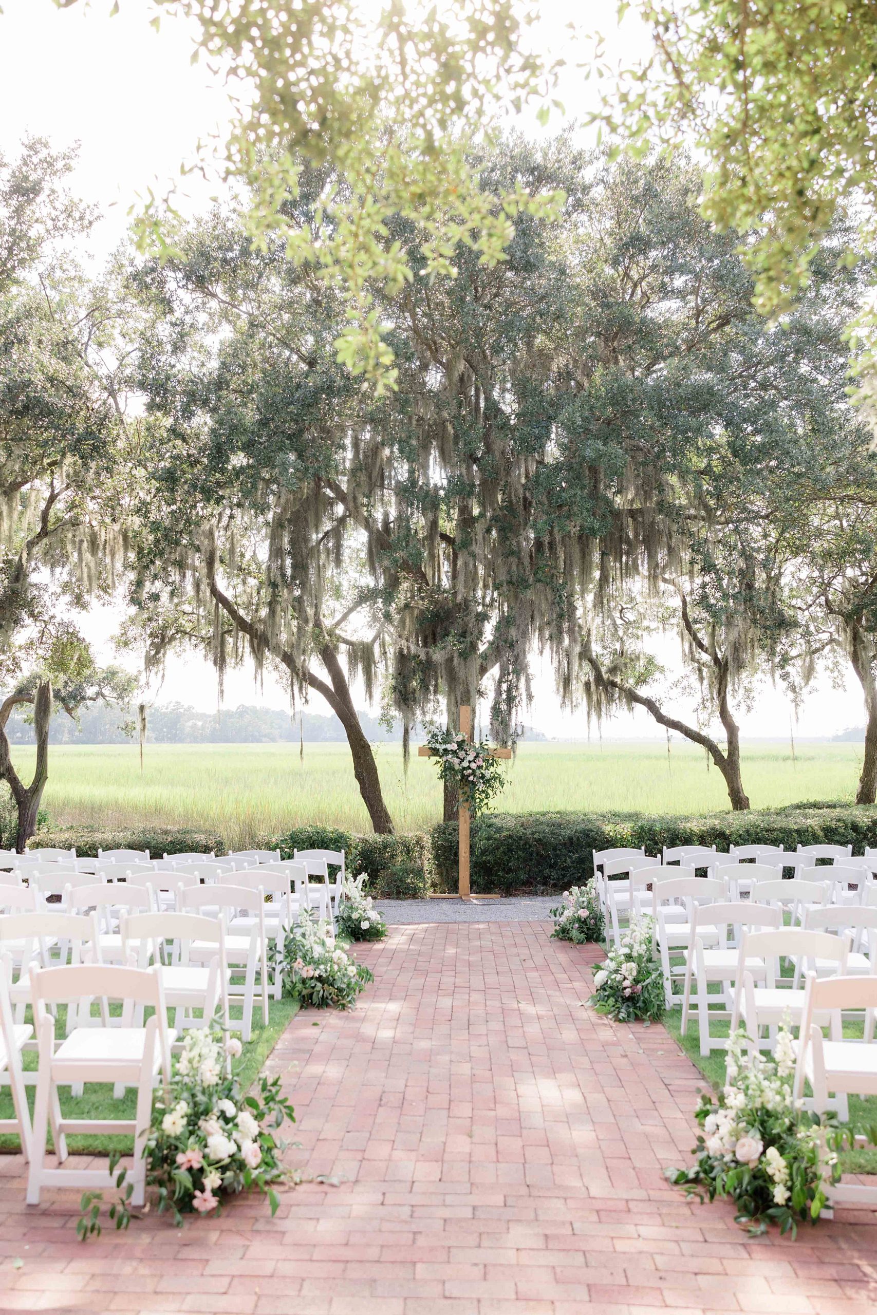 ceremony sit under oak trees at Club Creek at Ion