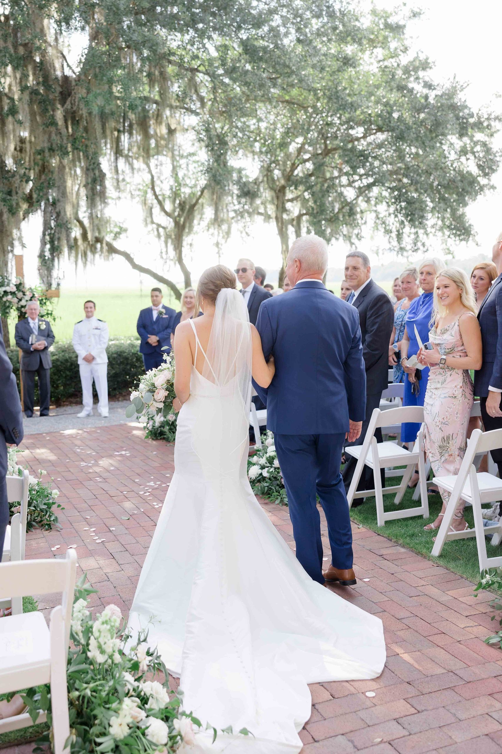 father walks bride up aisle at Club Creek at Ion