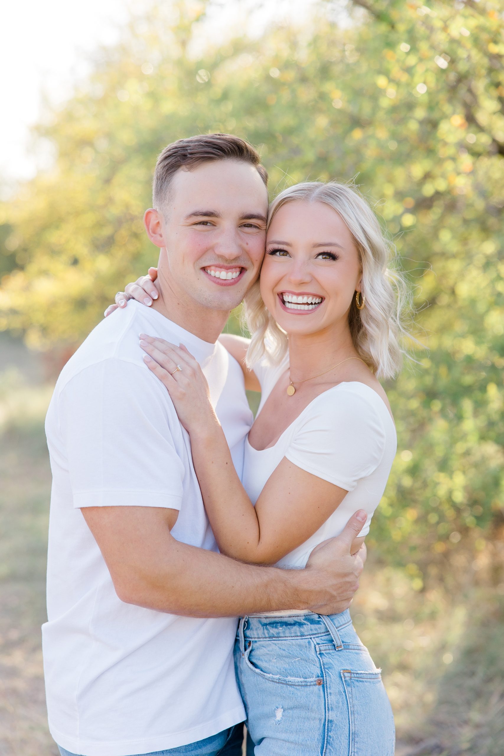 couple hugs during engagement portraits in Murrell Park