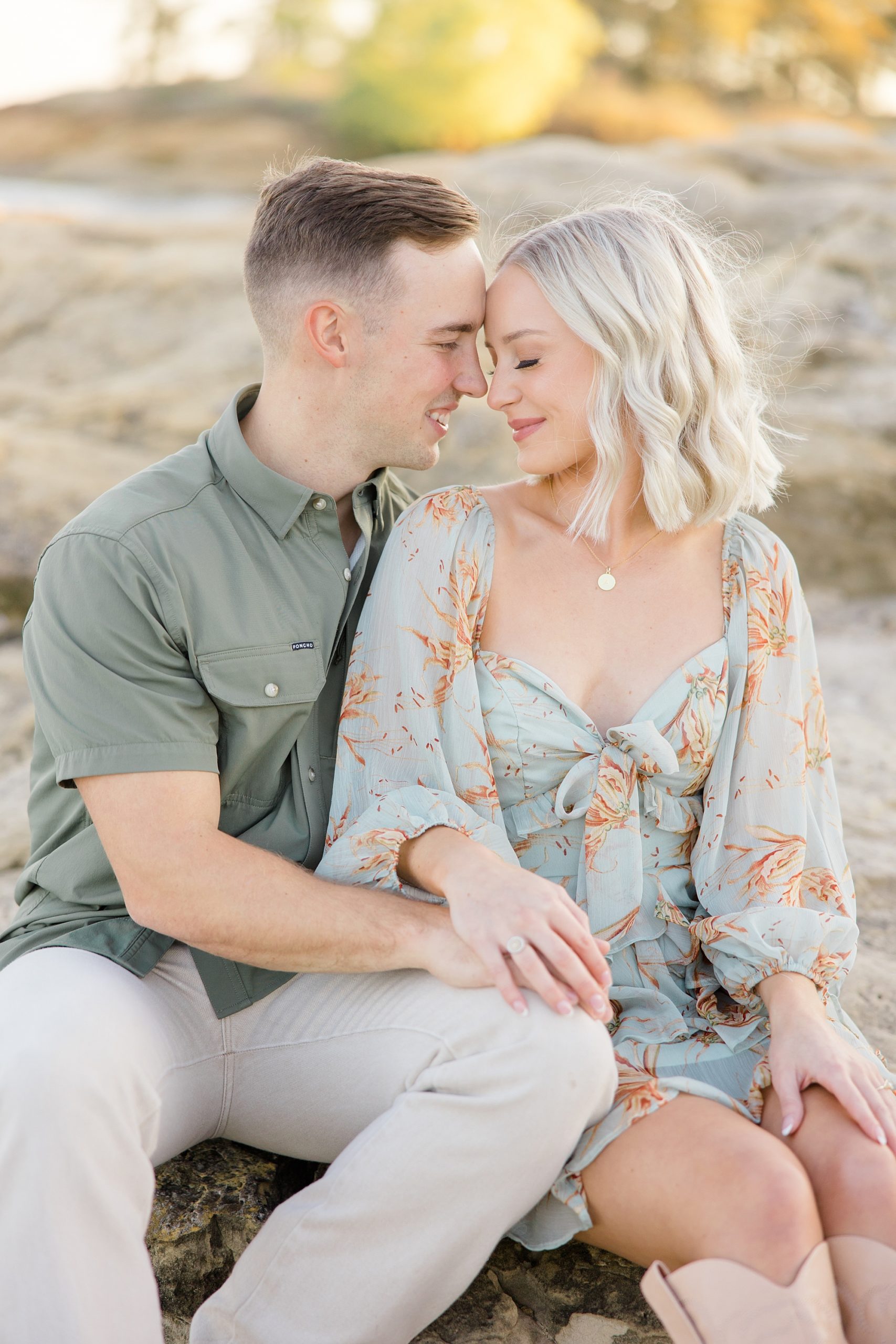 man leans head into woman's forehead during TX engagement session 