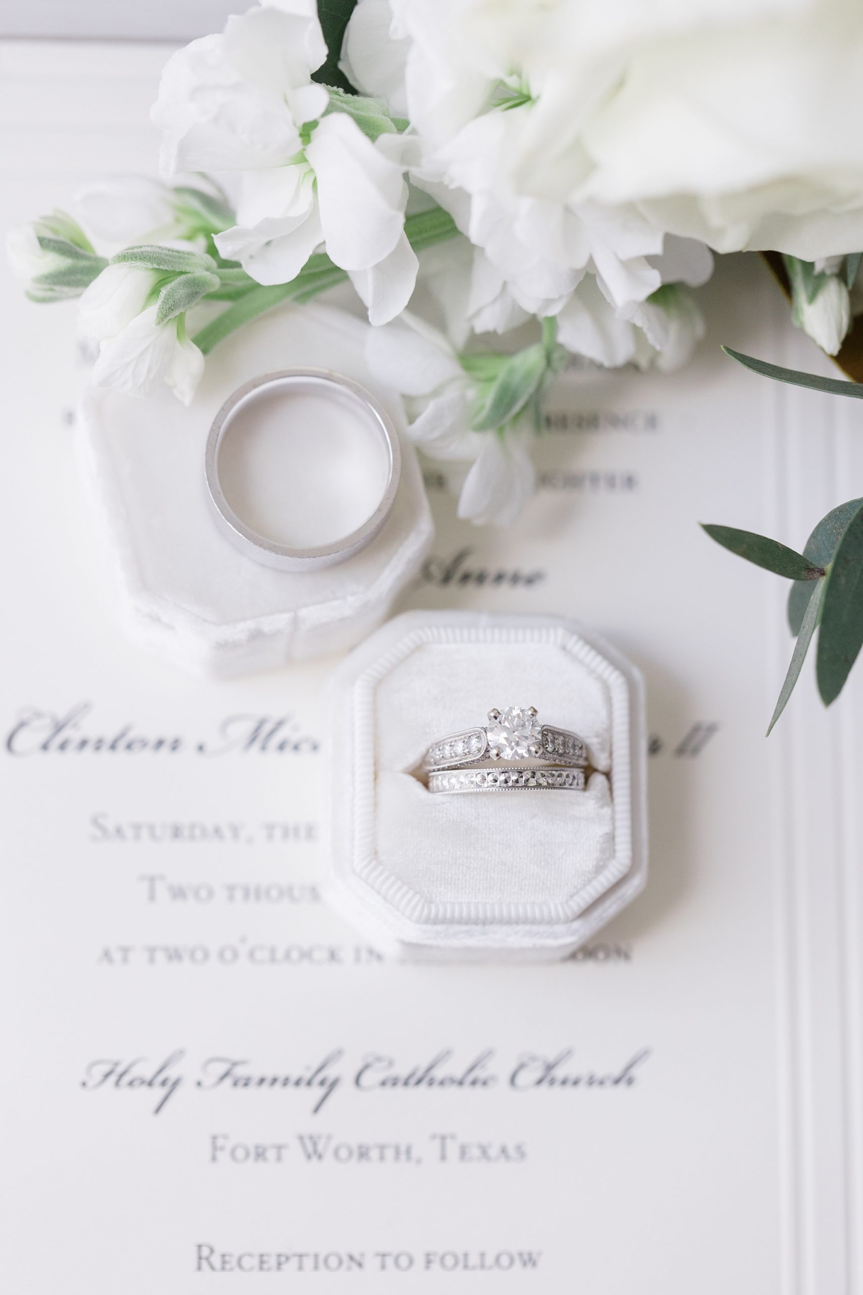 wedding rings in white box on classic stationery 