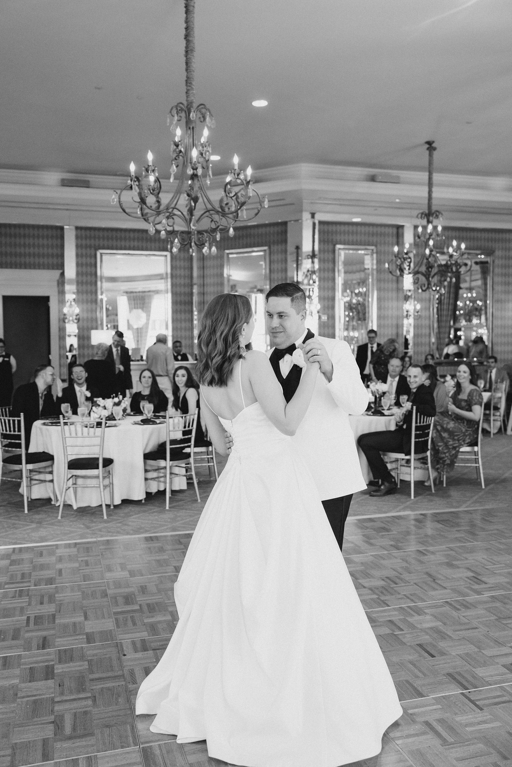 groom leads bride in dance during Fort Worth City Club wedding reception 