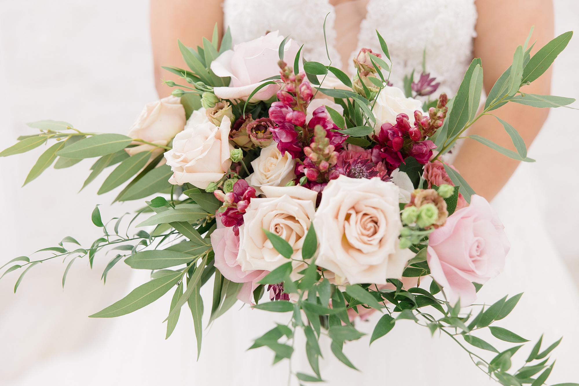 bride's bouquet of pink and magenta flowers for bridal portraits 