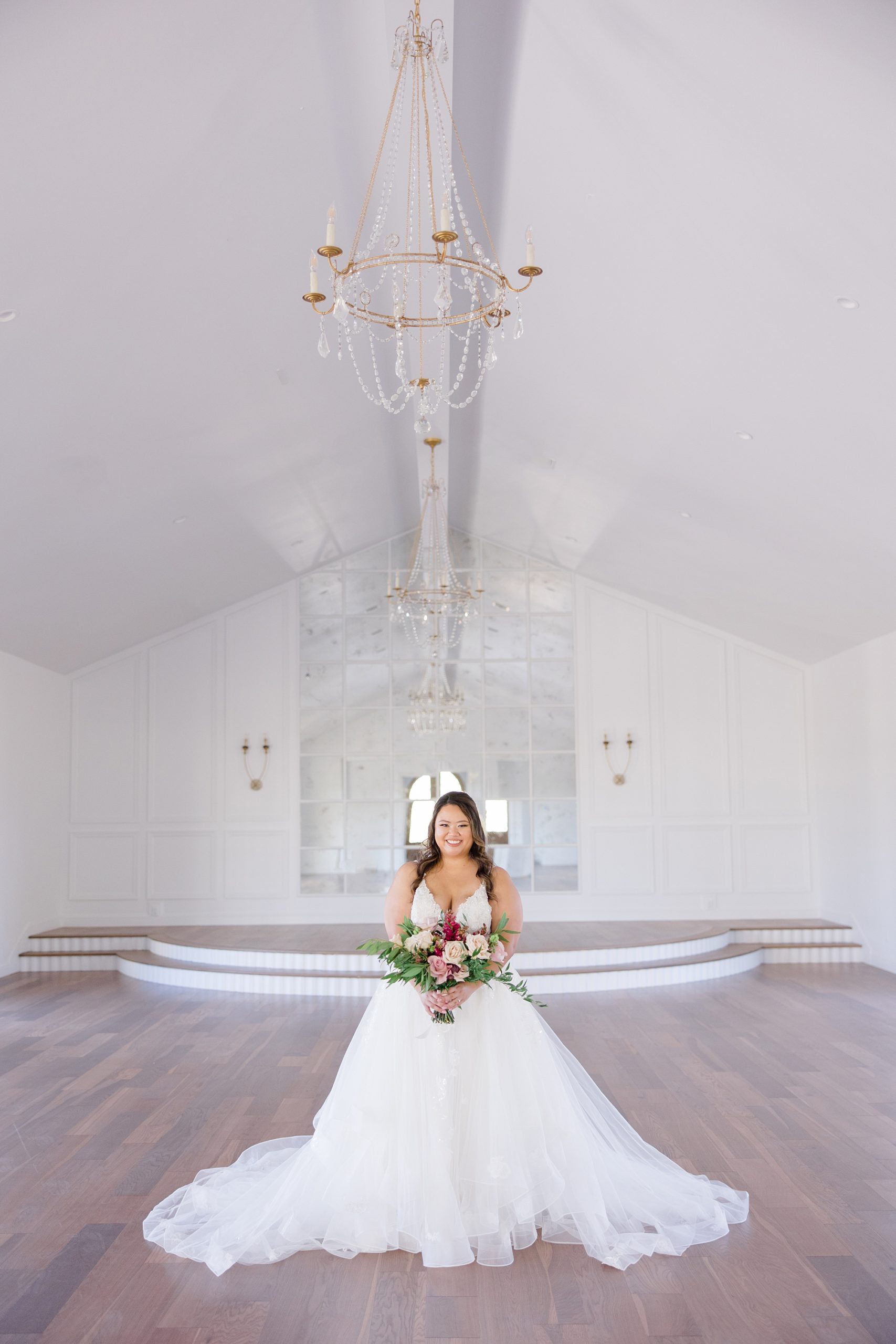 bride poses in chapel at The Nest at Ruth Farms