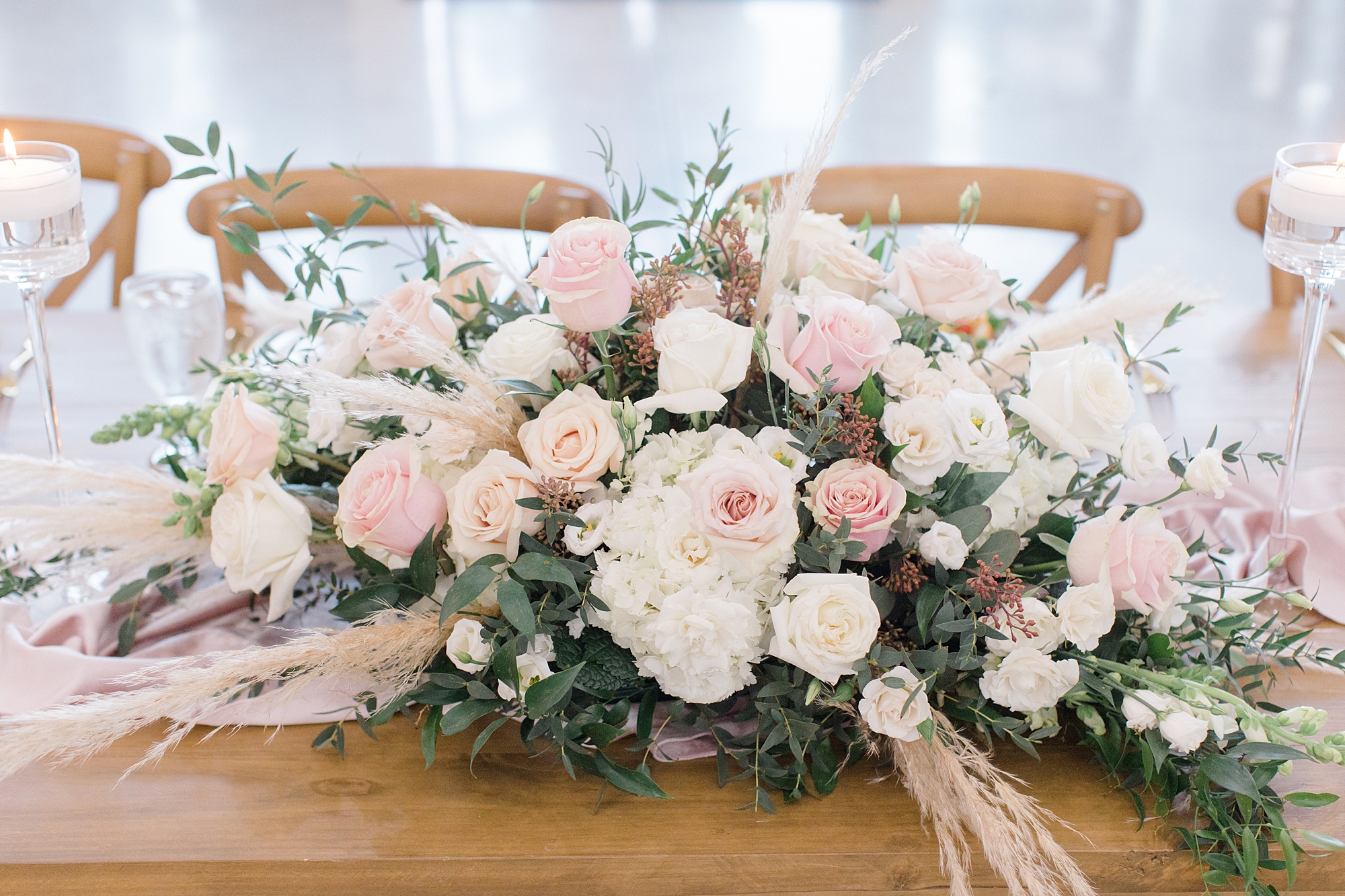 wedding reception centerpiece with pink and white flowers at The Gardenia