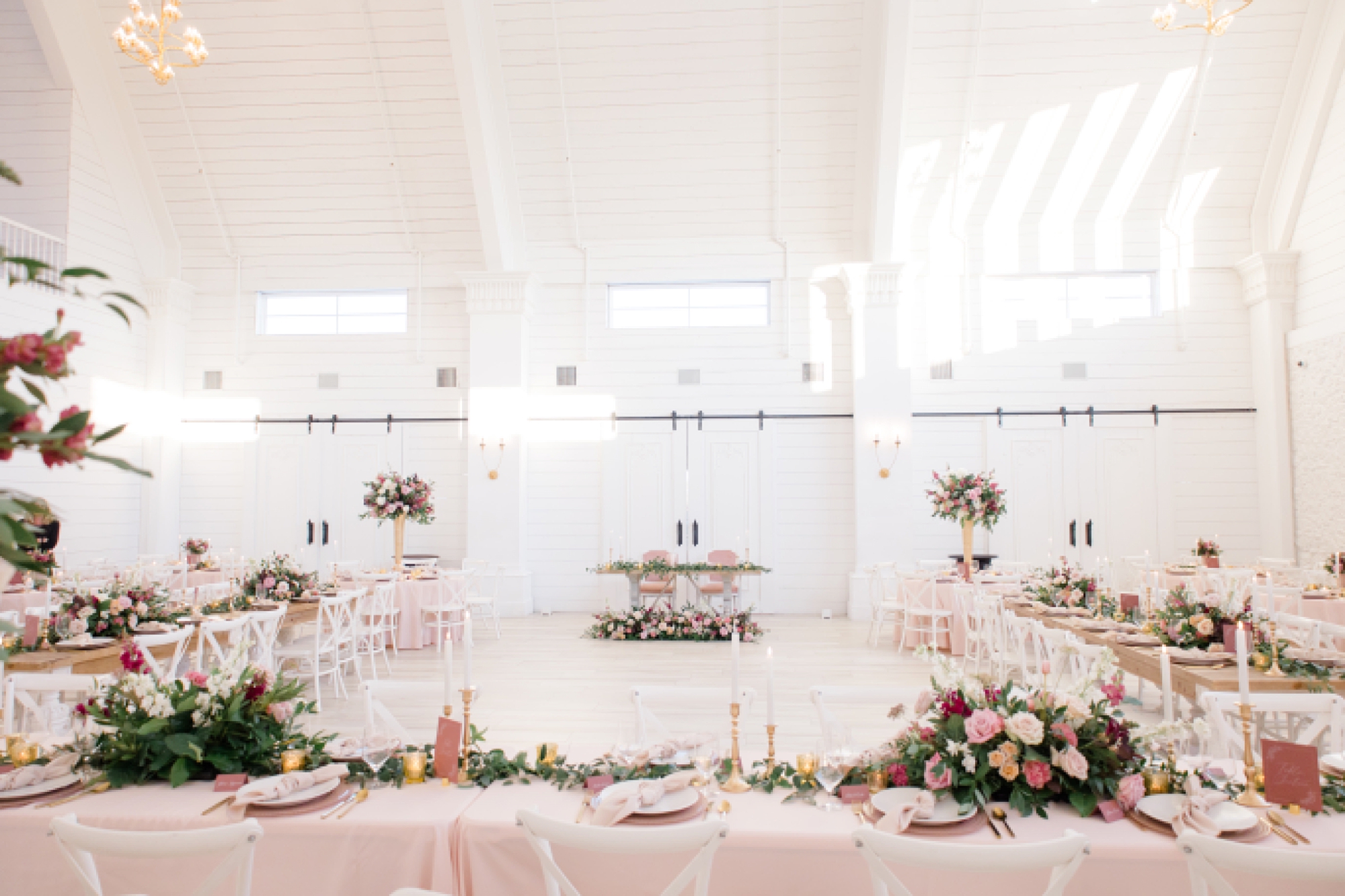 winter wedding reception at The Nest at Ruth Farms with pink details 