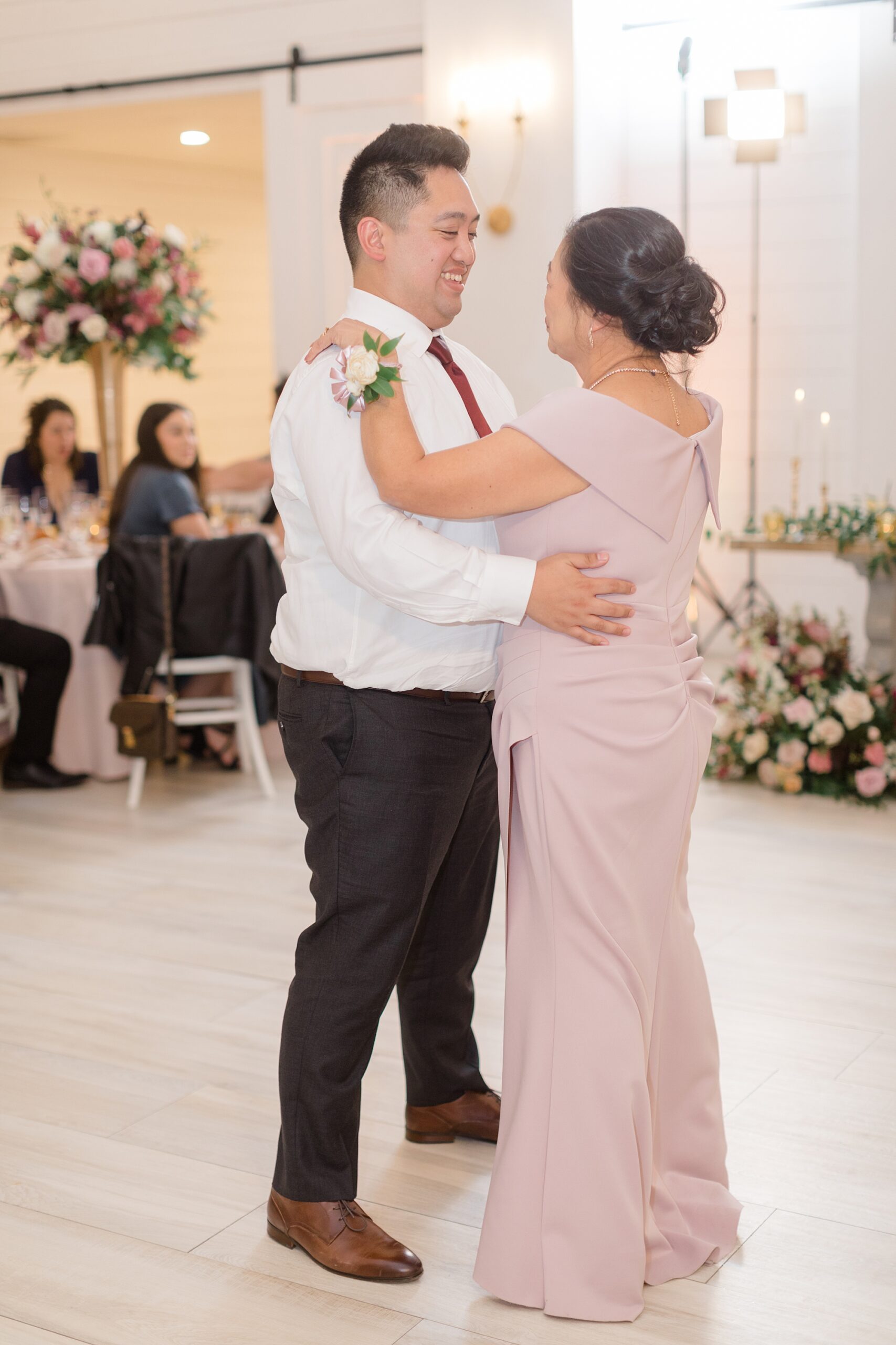 groom and mother dance during Nest at Ruth Farms wedding reception