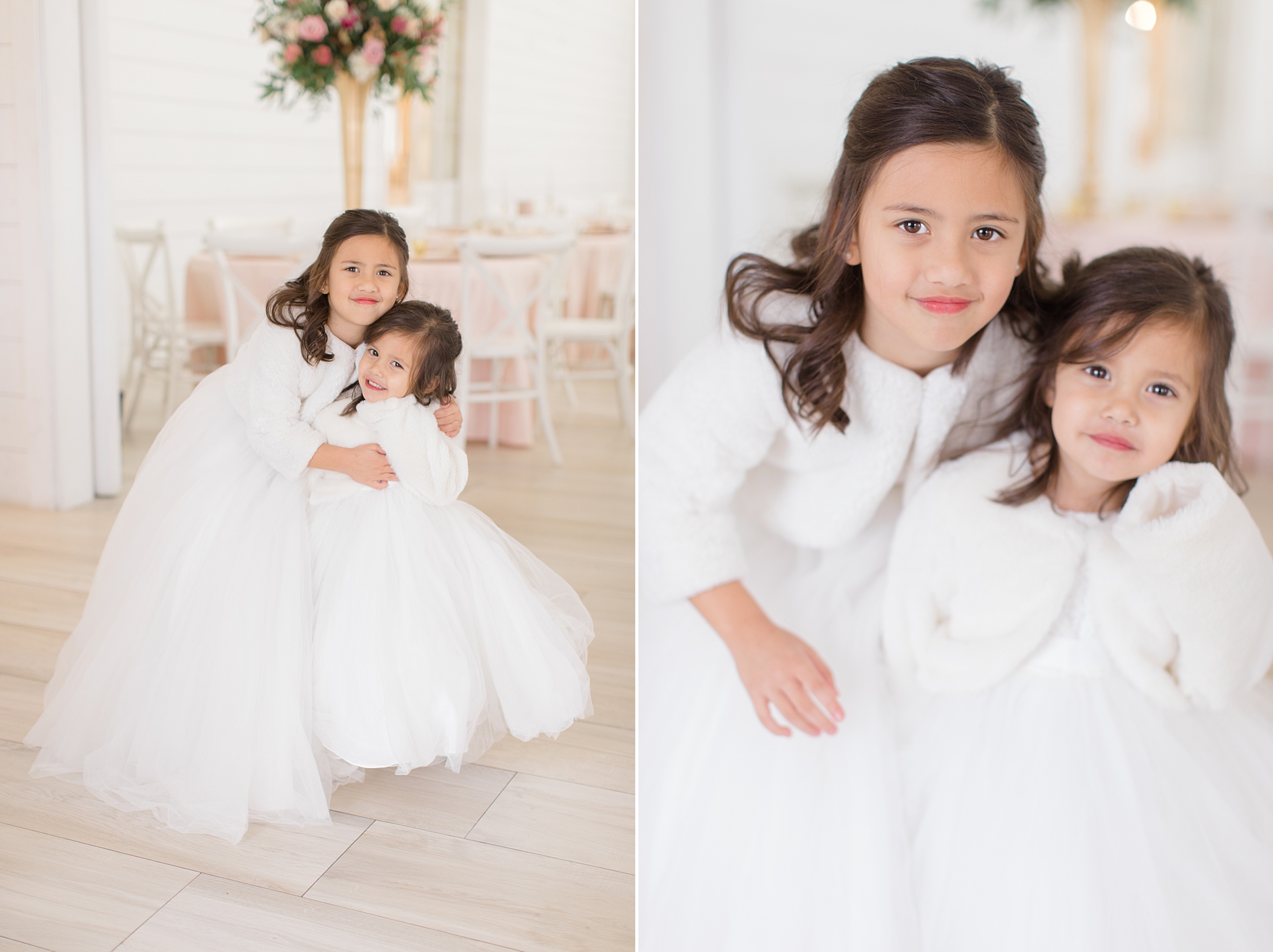flower girls hug in white dresses with white sweaters for winter wedding 